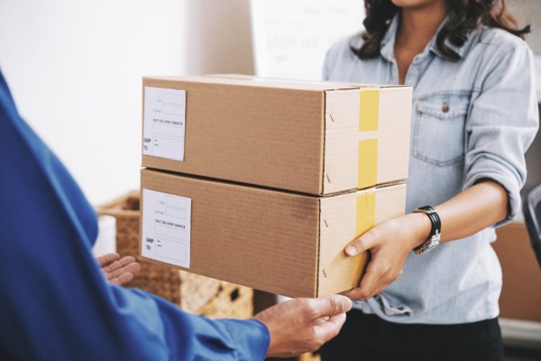 Carefully packaged delivery being handed over